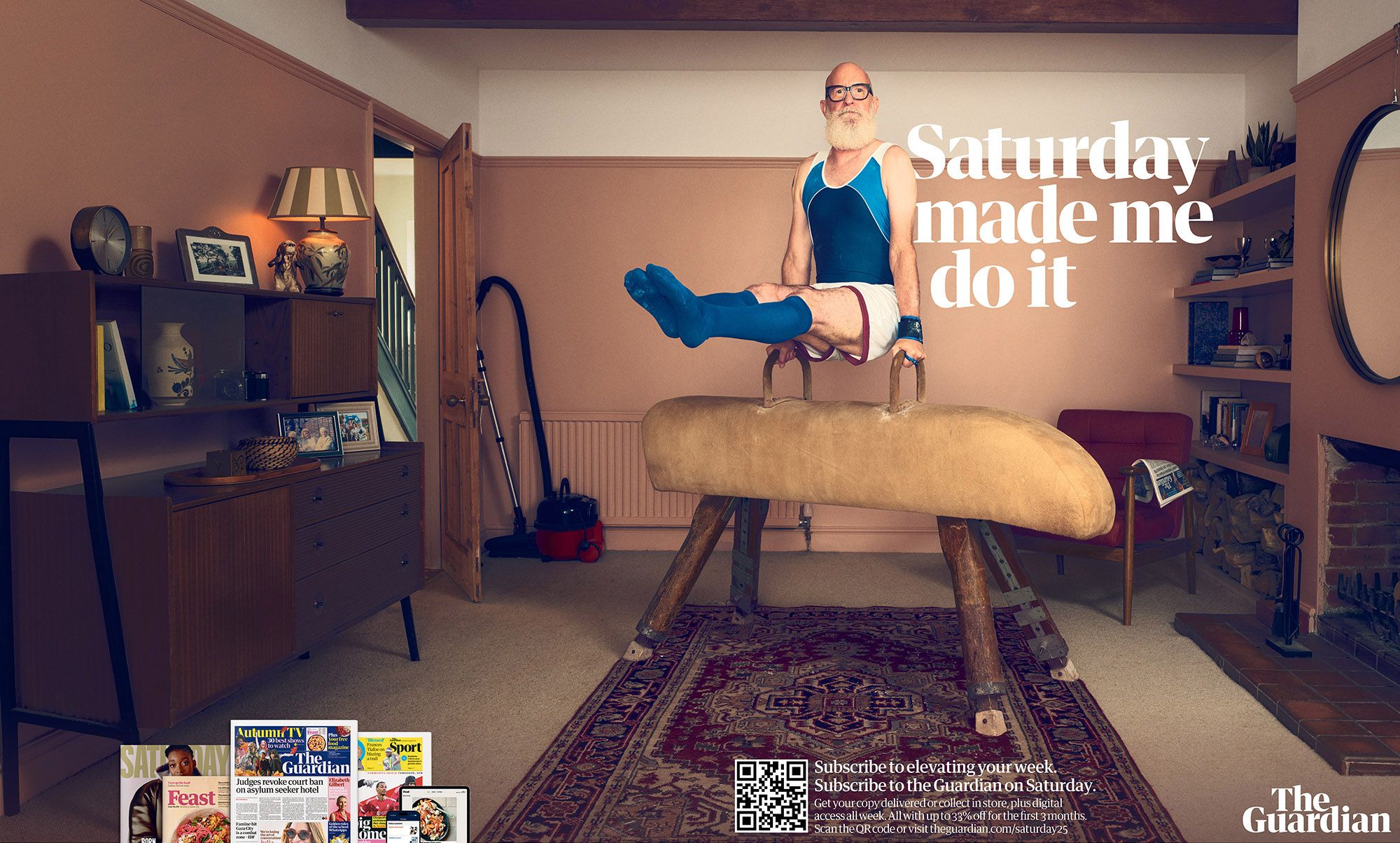 A man in a blue and white swimming costume, sitting on a gymnastics horse in a living room, surrounded by various household items.