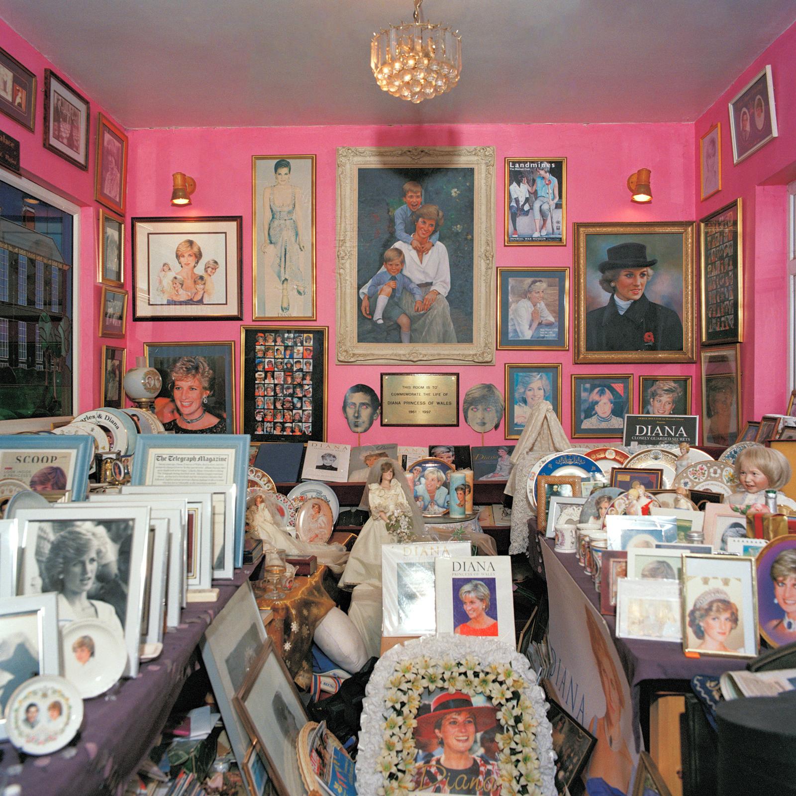 A room displaying multiple photos, posters, and items related to Princess Diana's life.