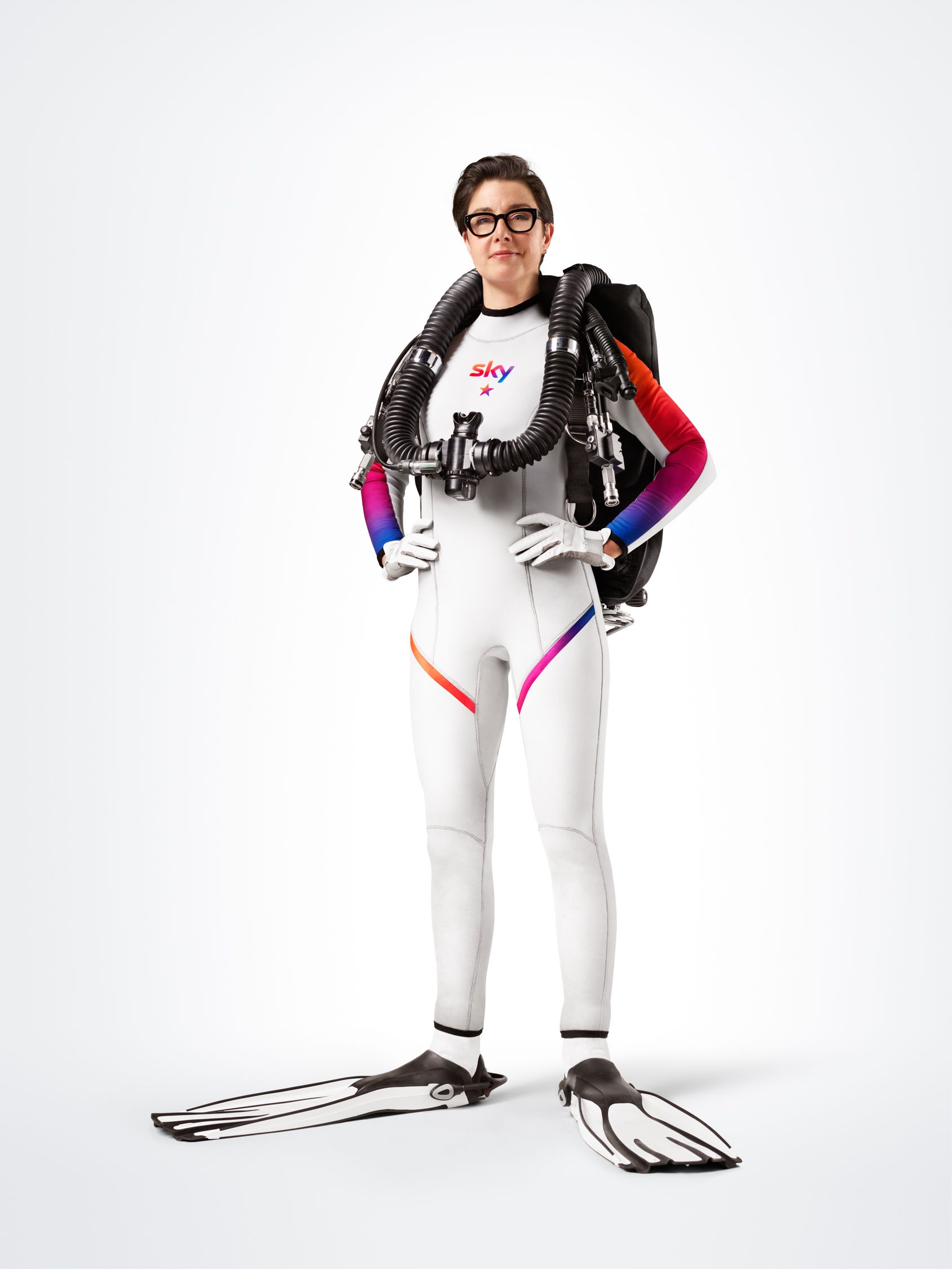 A person wearing a wetsuit and scuba diving equipment, likely for a celebrity or celebrity-related project.