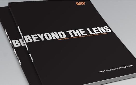 A book with a black cover and the title 'AOP - Beyond the Lens' in white letters.
