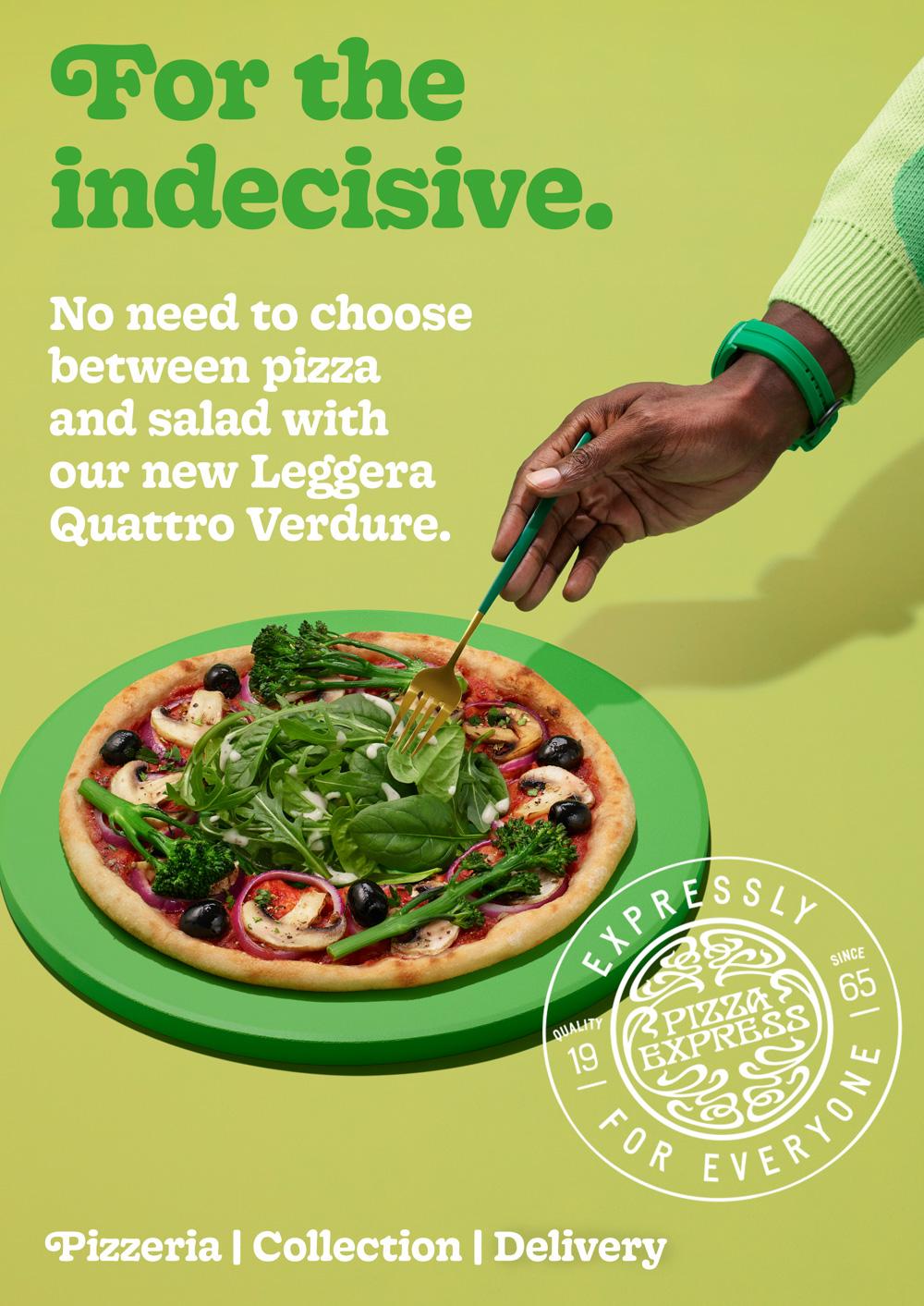 A pizza with vegetable toppings and a hand holding a fork.