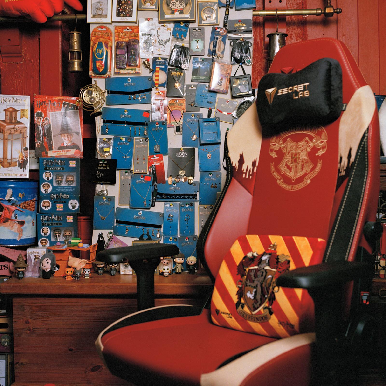 A desk with a chair and various Harry Potter-themed items such as a Hogwarts chair, a book, and an acceptance letter.