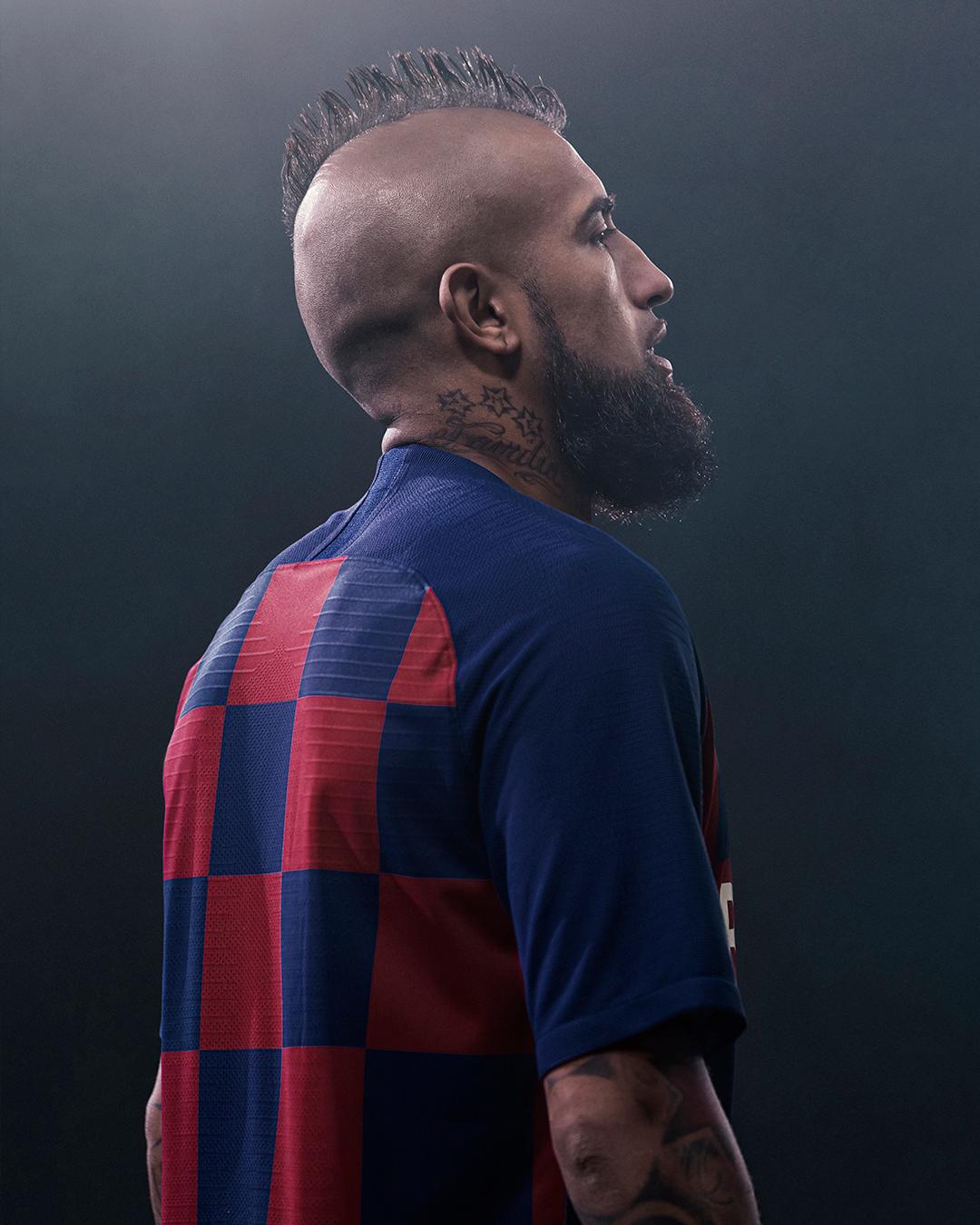 Artist Marco Mori wearing a Barcelona football jersey.