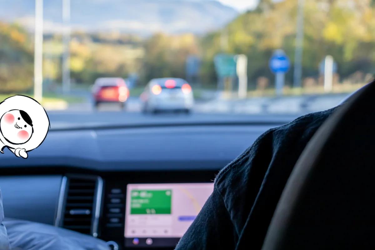View from inside a car showing navigation on the dashboard display, illustrating how Waze works with Android Auto for real-time driving directions.