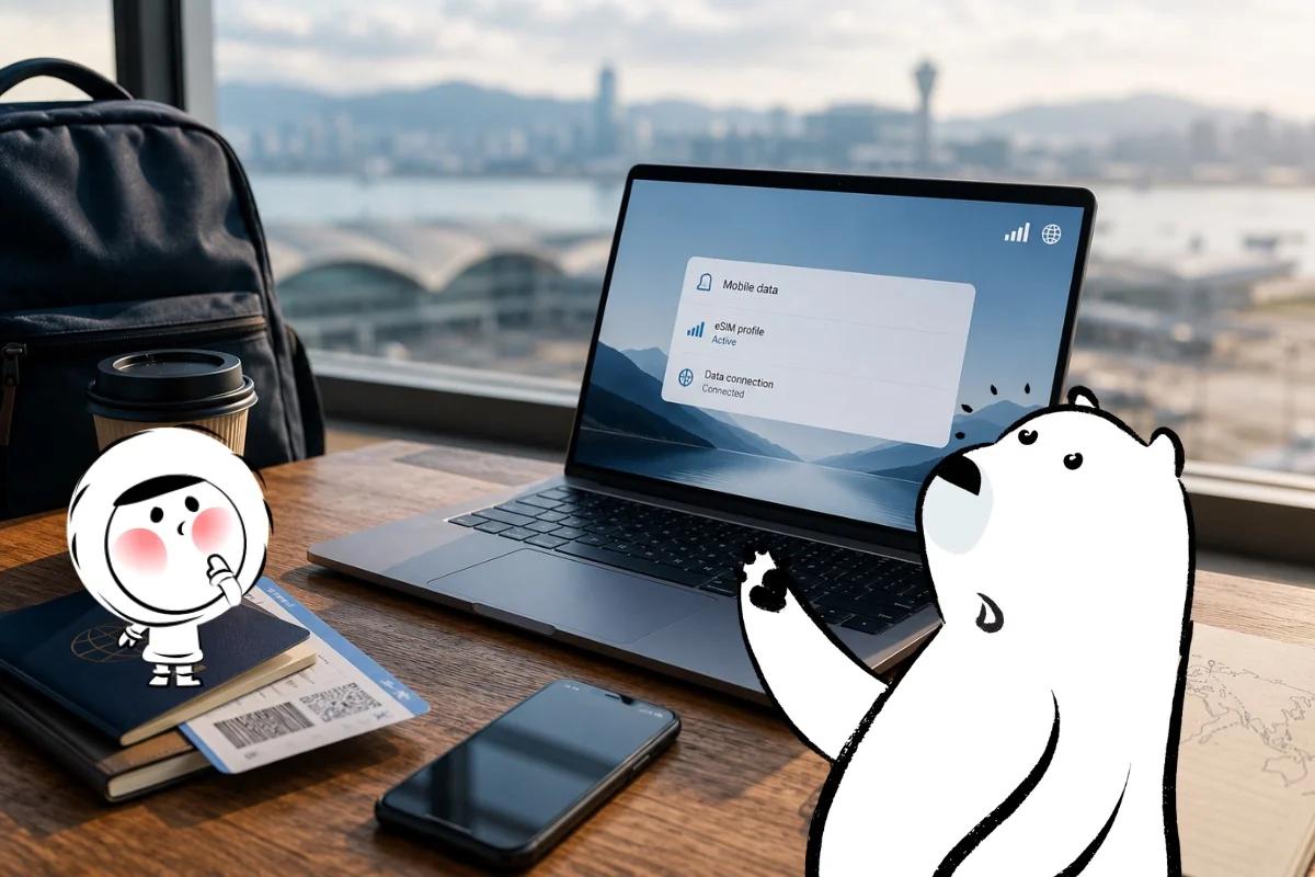 Traveler working on a laptop with mobile data settings open in an airport lounge, with a phone, passport, and boarding pass nearby.