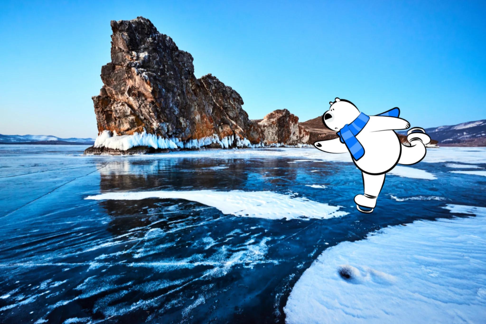 Frozen lake surface with deep blue ice patterns and a rocky island rising from the ice under a clear sky.