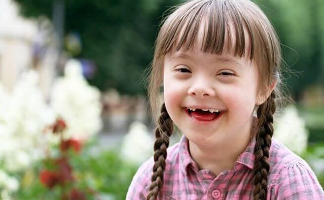Smiling girl with braids outdoors