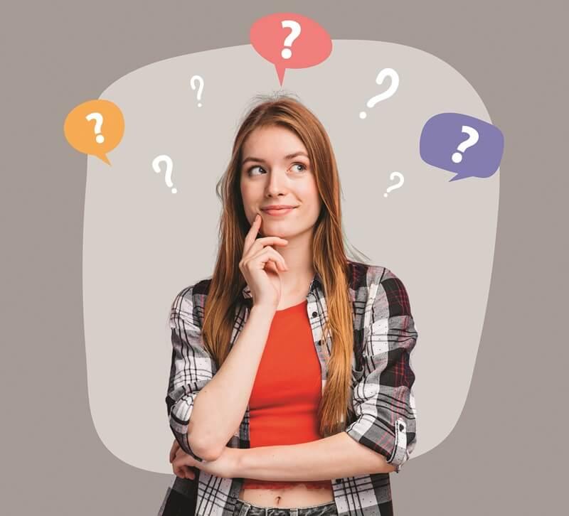 Woman with her hand on her chin surrounded by question marks