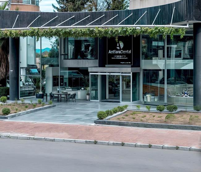 Glass clinic entrance with outdoor seating