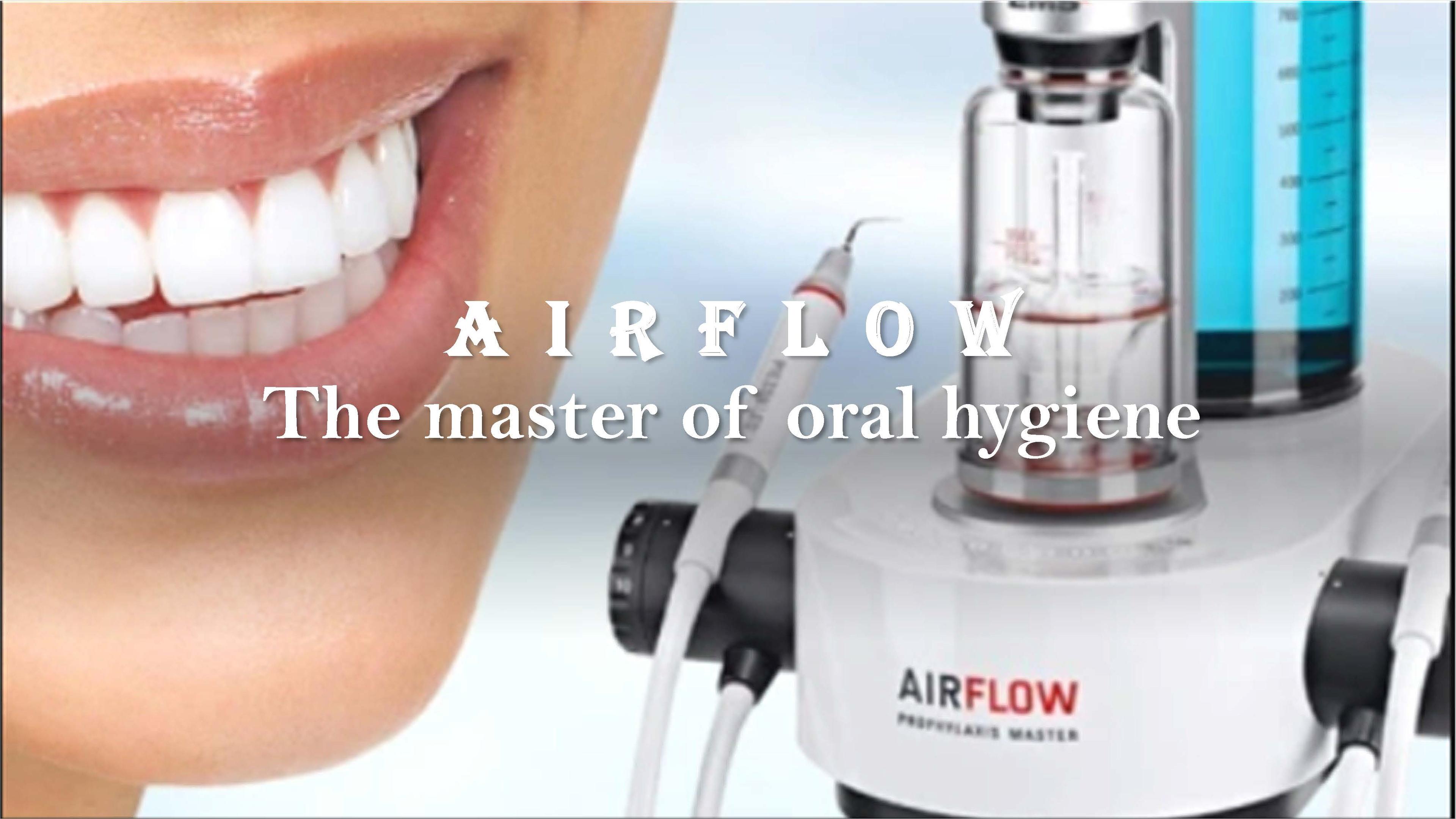 Smiling mouth next to an Airflow air-polishing unit
