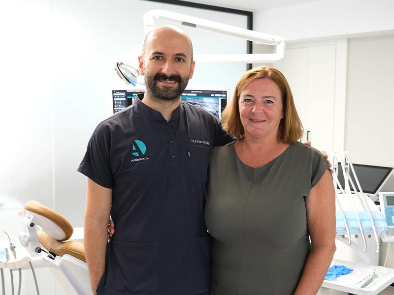 A patient and their dentist after treatment was completed