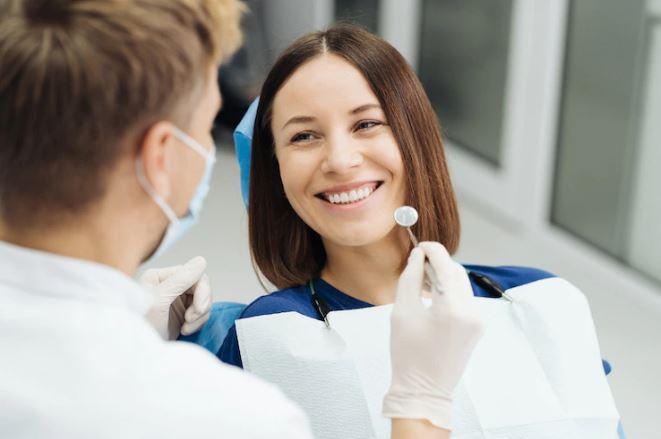 A patient and a dentist during a smile makeover consultation