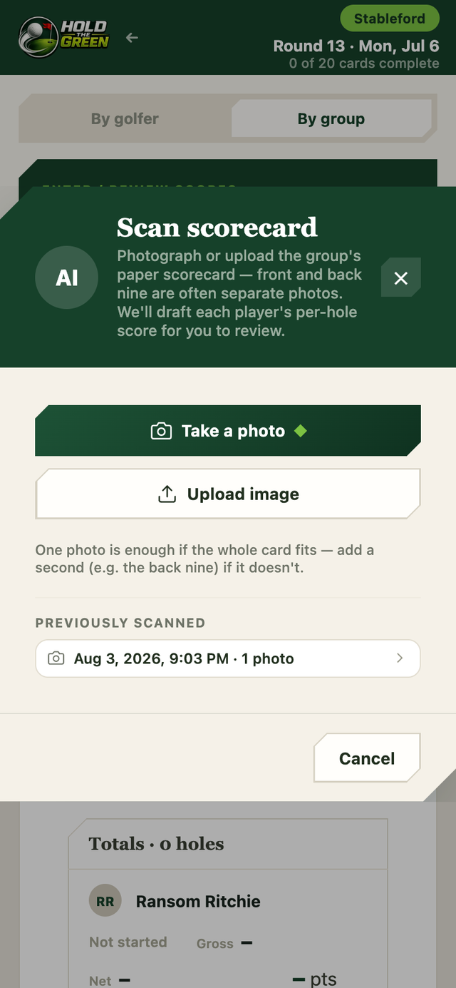 A phone showing the Scan scorecard dialog, offering to take a photo or upload an image of the group’s paper scorecard