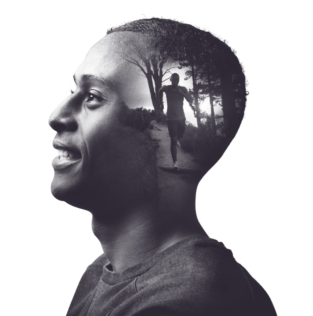 Double-exposure portrait of a man in profile, with a runner on a forest trail inside his silhouette