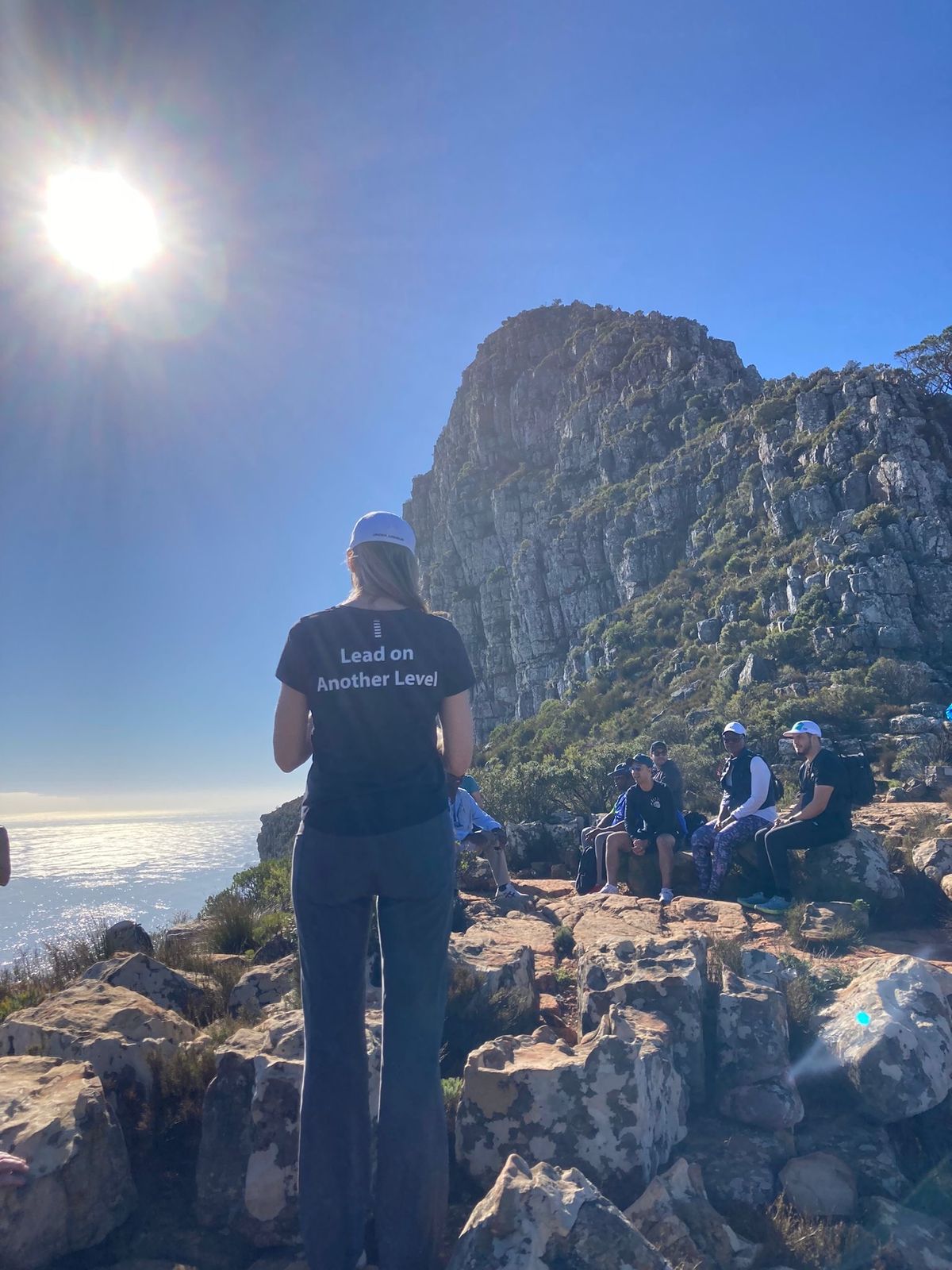 A climber reaching a summit