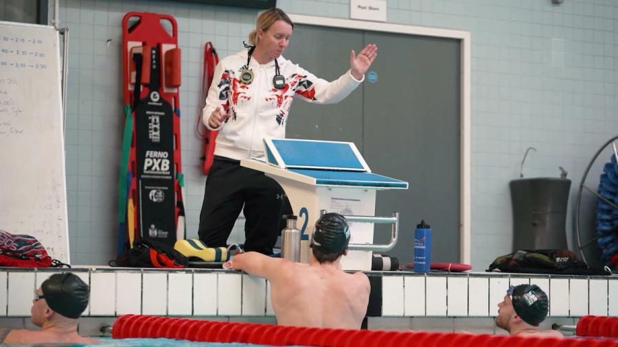 Mel Marshall MBE coaching swimmers poolside