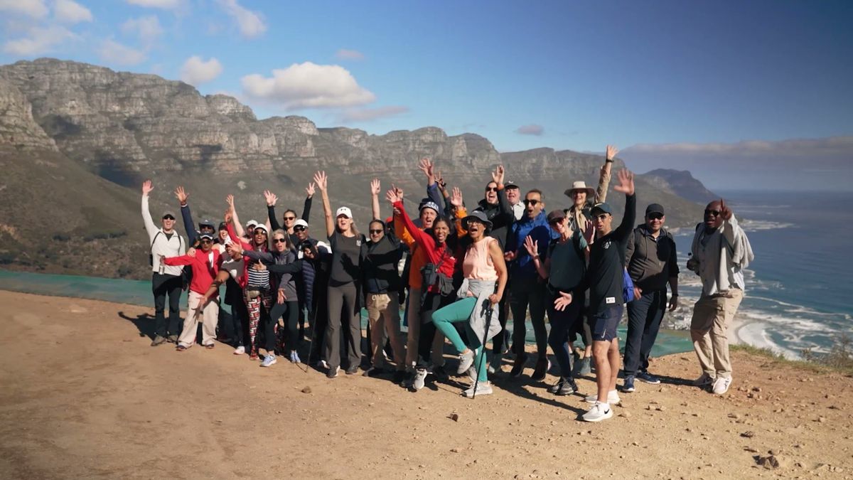 A TLH group celebrating on a clifftop in Cape Town