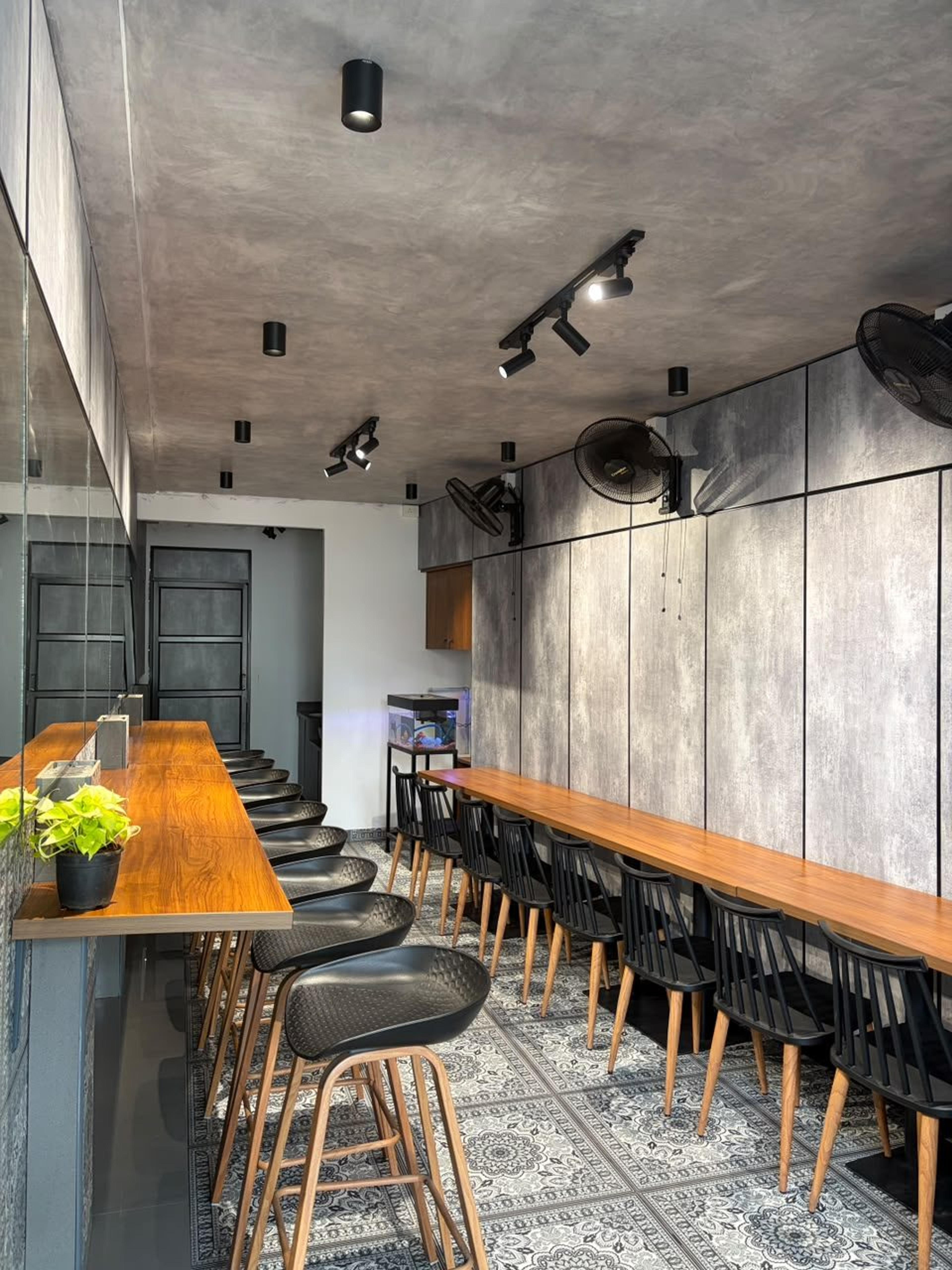 Pantry bar stools and chairs along two long wooden counters