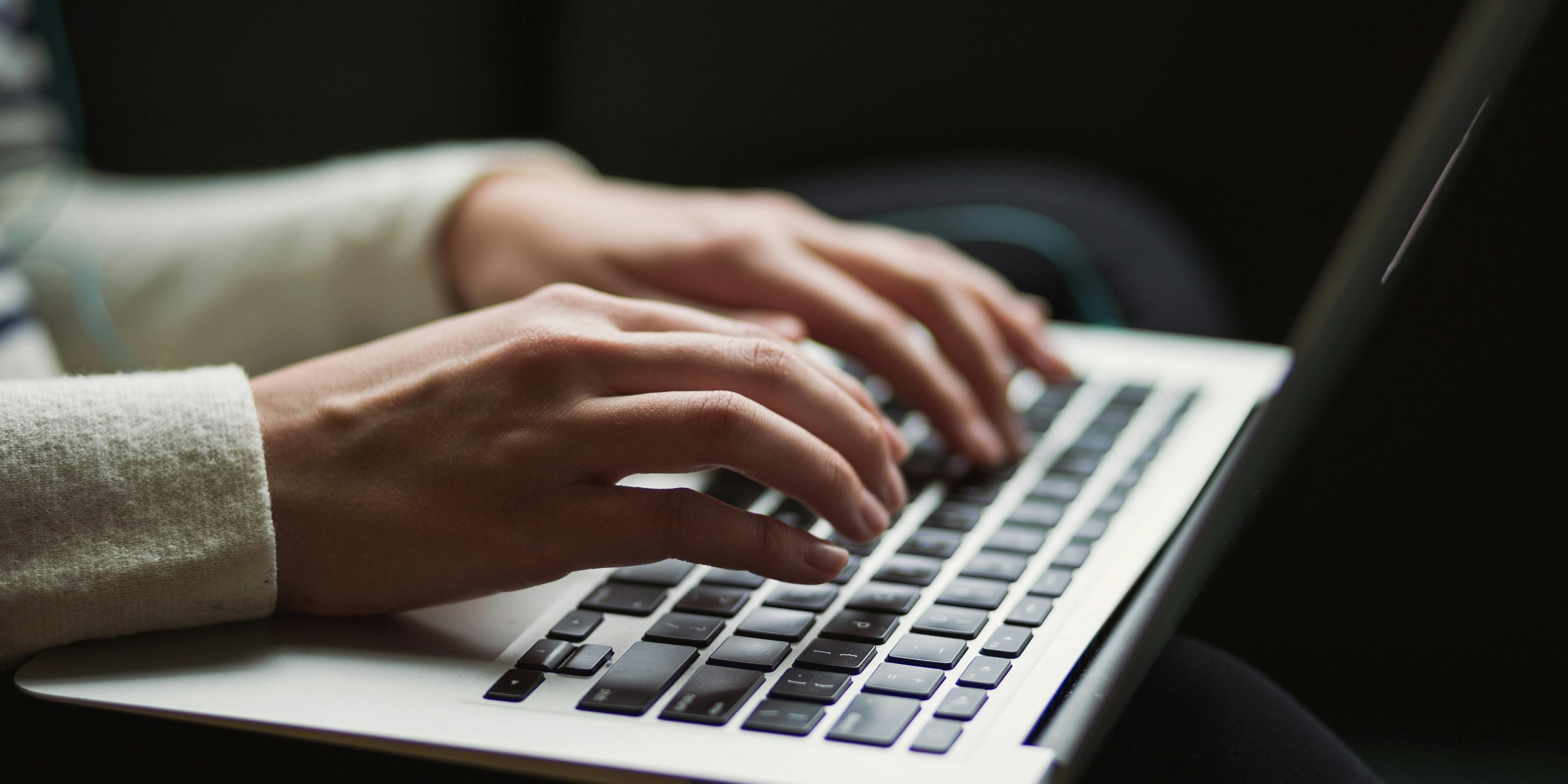 Image of typing on computer