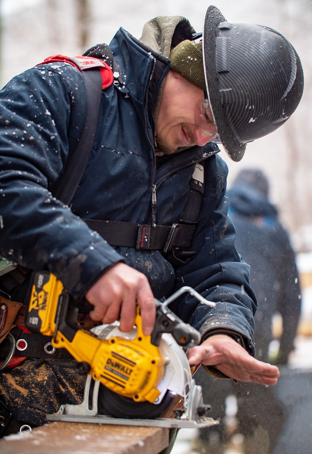 man using a machine saw