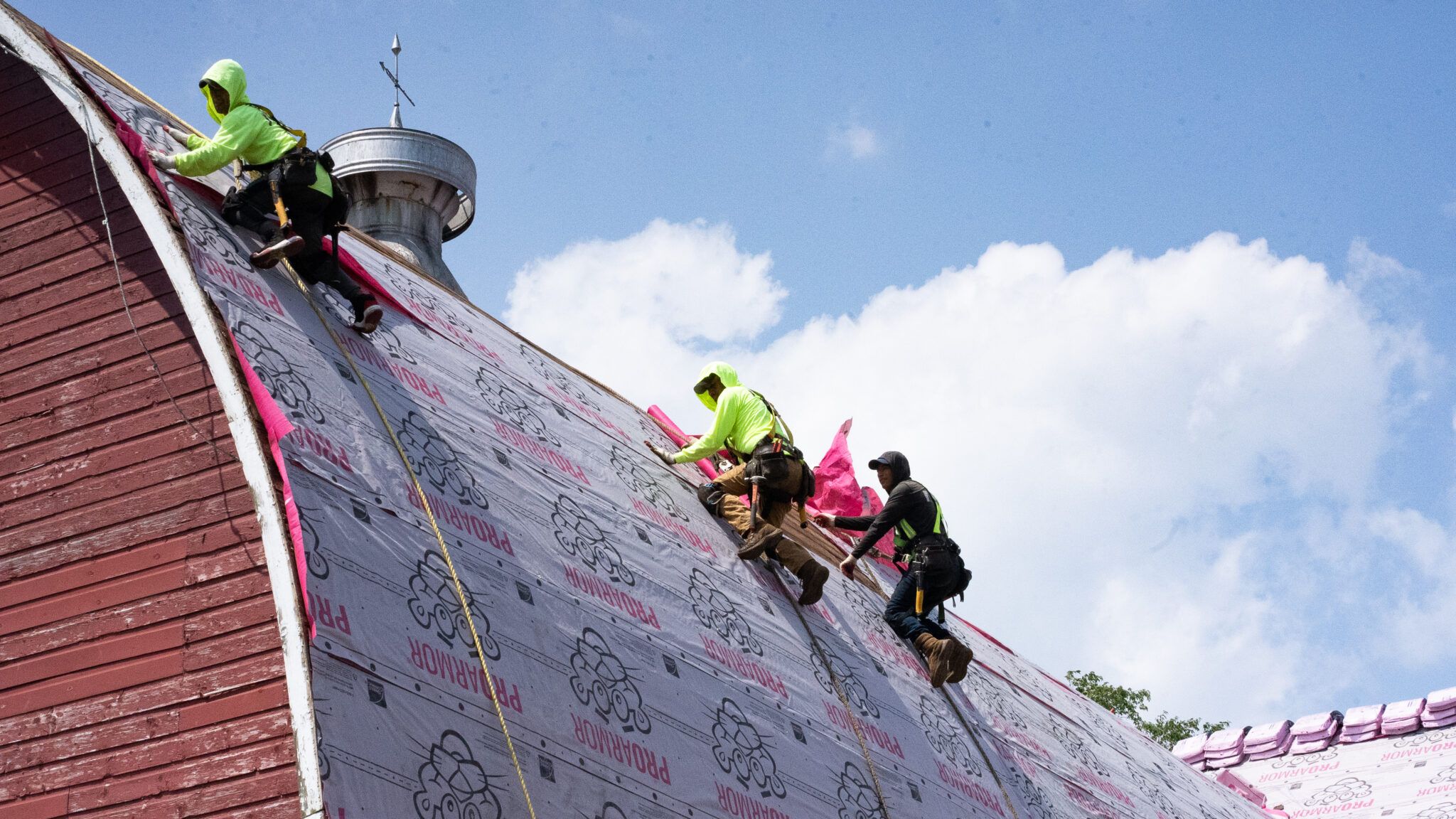 man working on roof