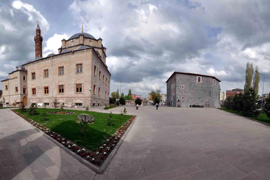 Harakani Mosque and complex, cloudy sky, people walking, Uluslararası Harakani Kültür Vakfı