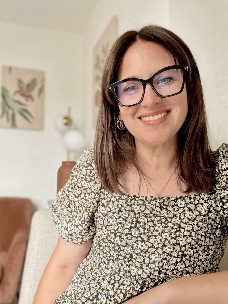 Kelsey Wiemer, CBT psychotherapist, smiling at home