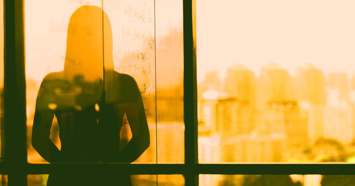 Silhouette of woman in executive office 