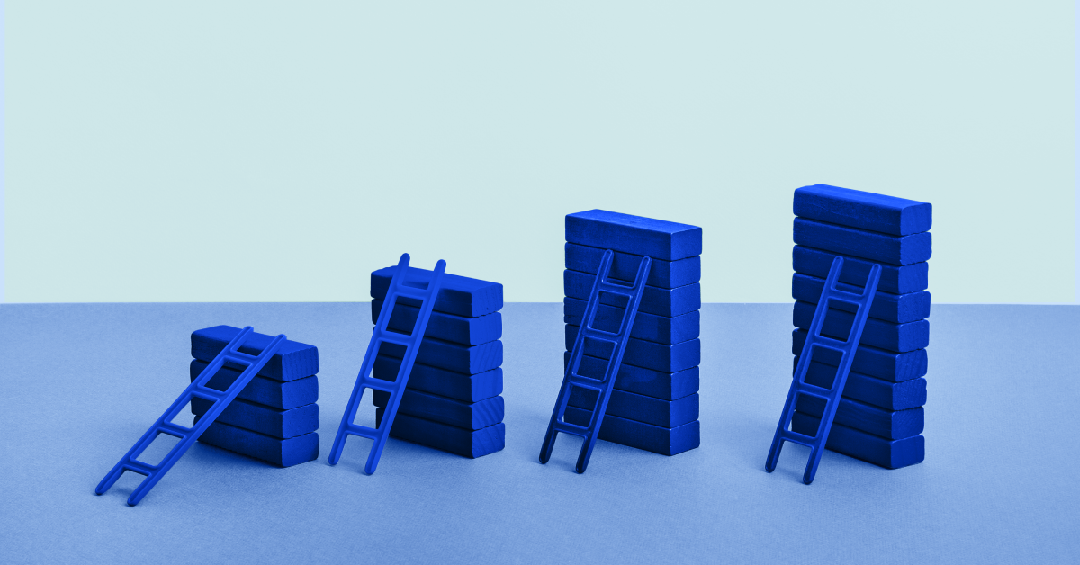 Four blue locks of different heights with blue ladders leaned against them. 