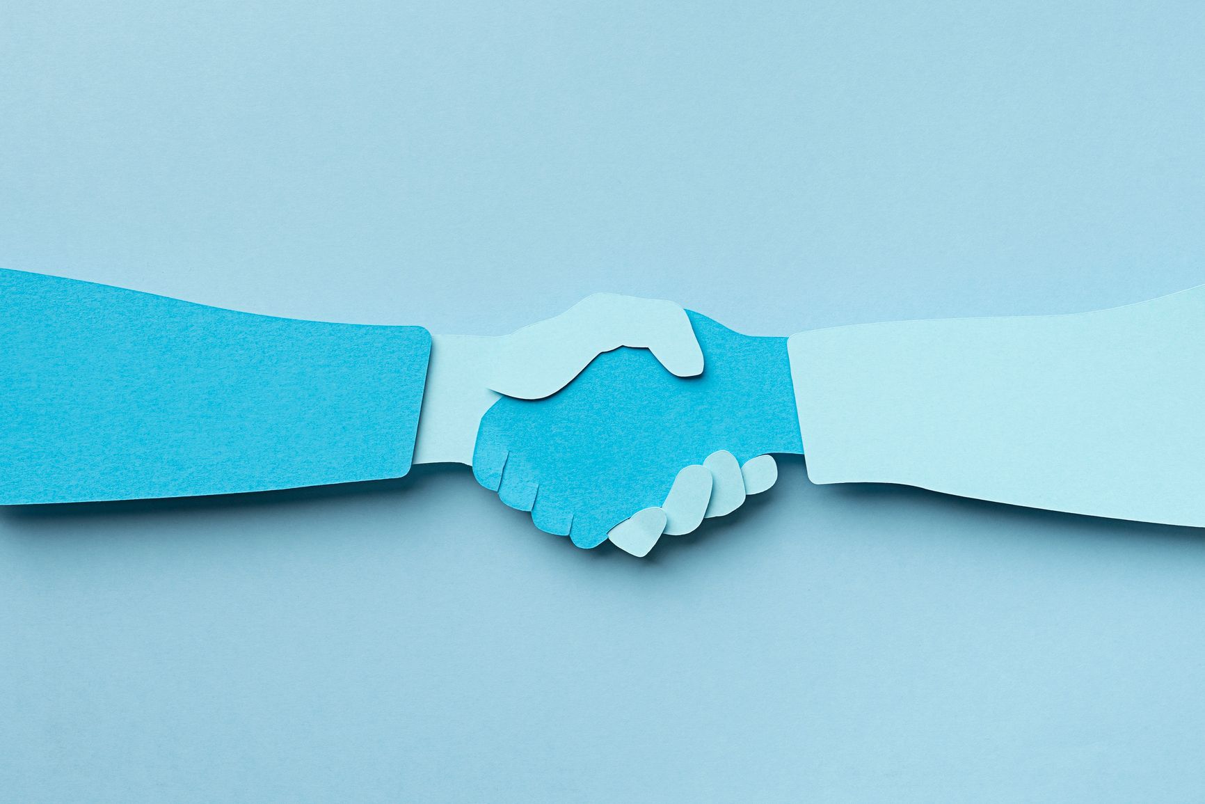 Pair of hands shaking in agreement