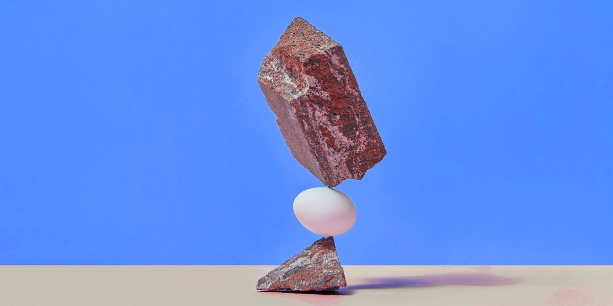 Rocks stacked precariously representing uncertainty