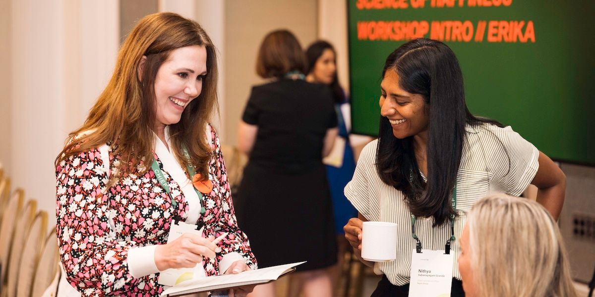 Two Chief Members smiling and participating in an icebreaker activity at ChiefX Boston