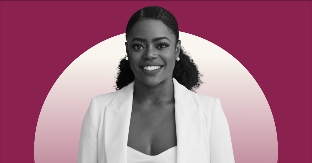A headshot of Nneka Ukpai with a white shirt and white blazer on against a fuchsia background. 