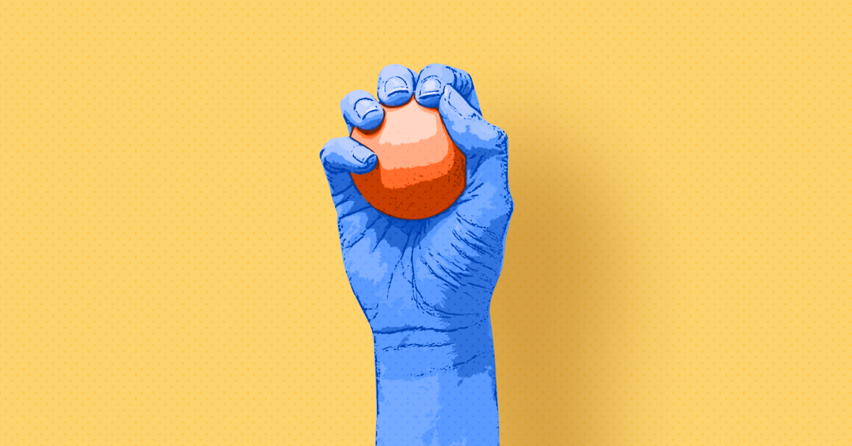 A hand holding a stress ball. 