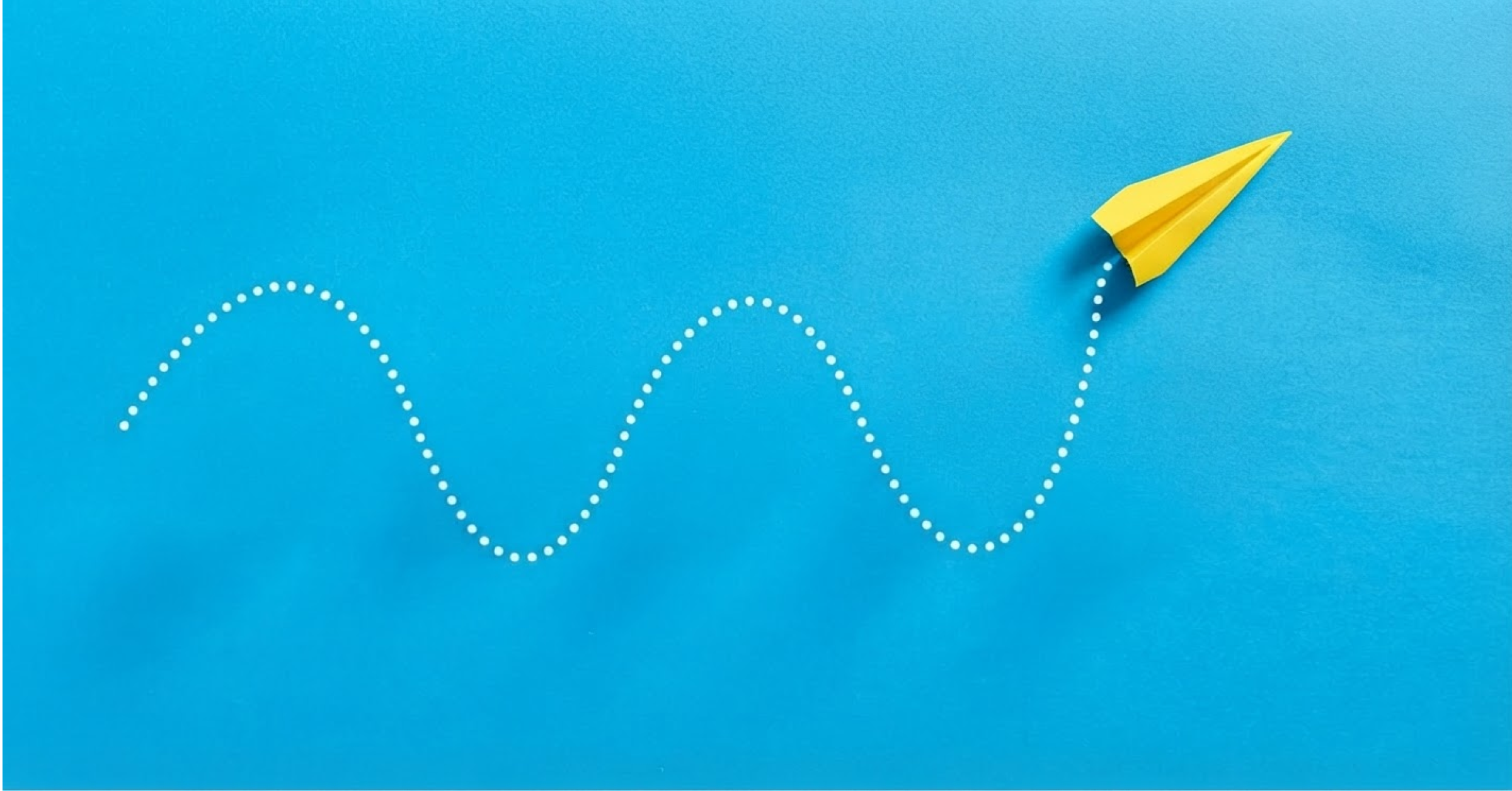Illustration of paper airplane following curving path