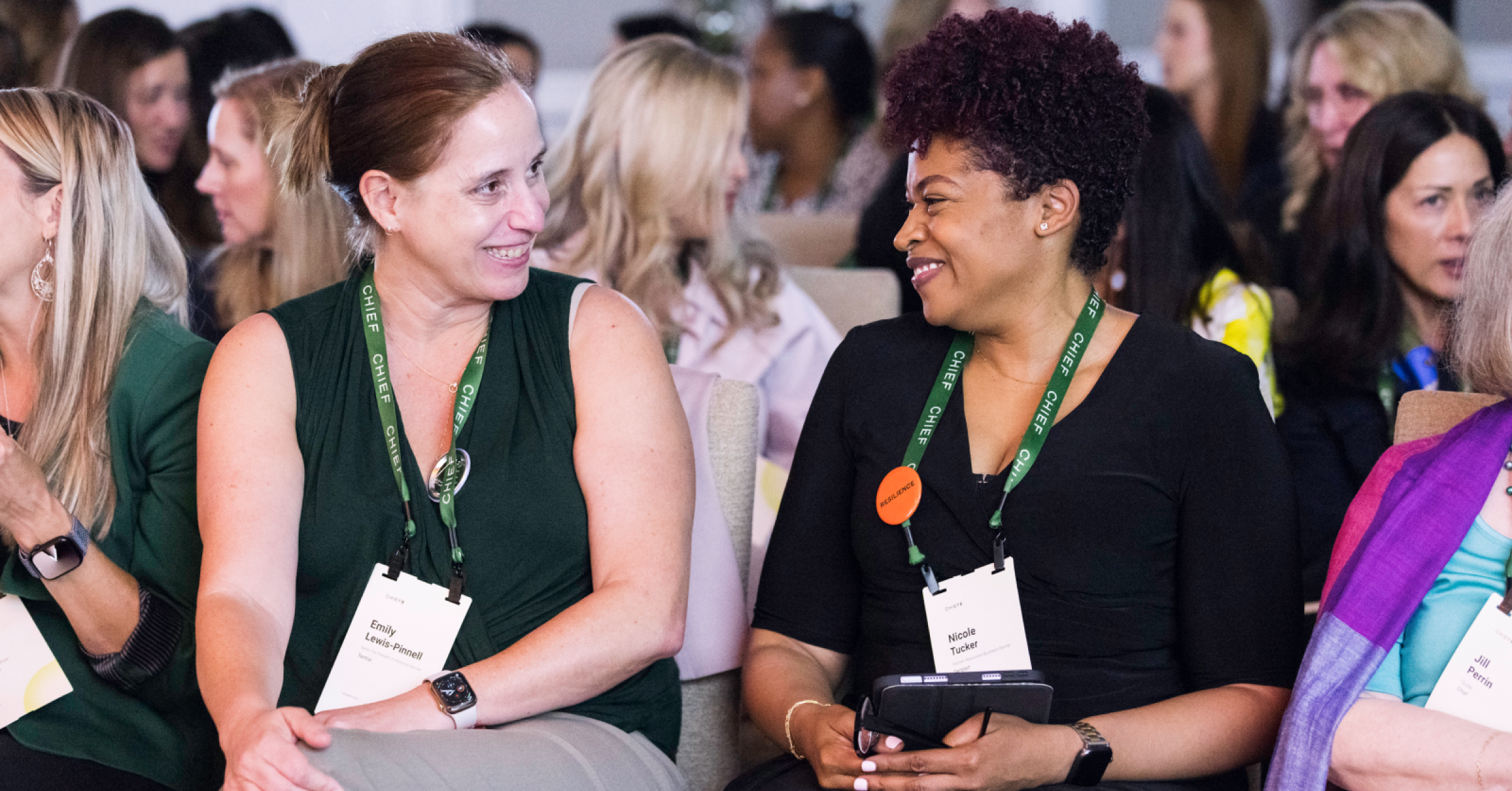 Two members in conversation at a ChiefX summit