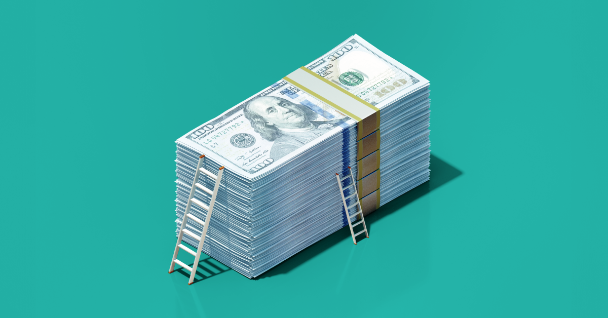 A stack of money with two uneven ladders leaning against it on a turquoise blue background. 