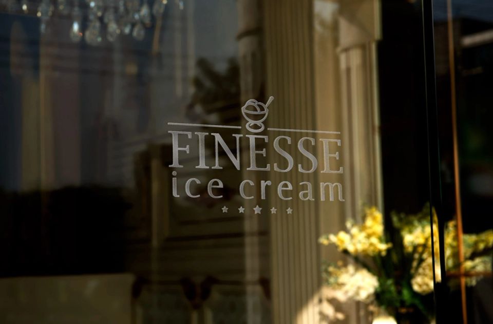 The Finesse ice cream mark etched into the shop's glass door