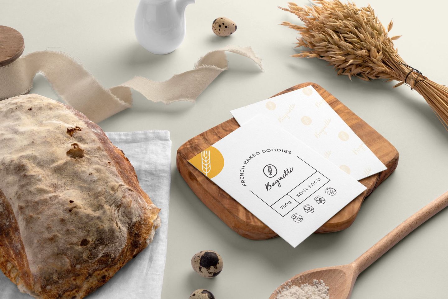 Baguette brand cards on a wooden board with bread and wheat