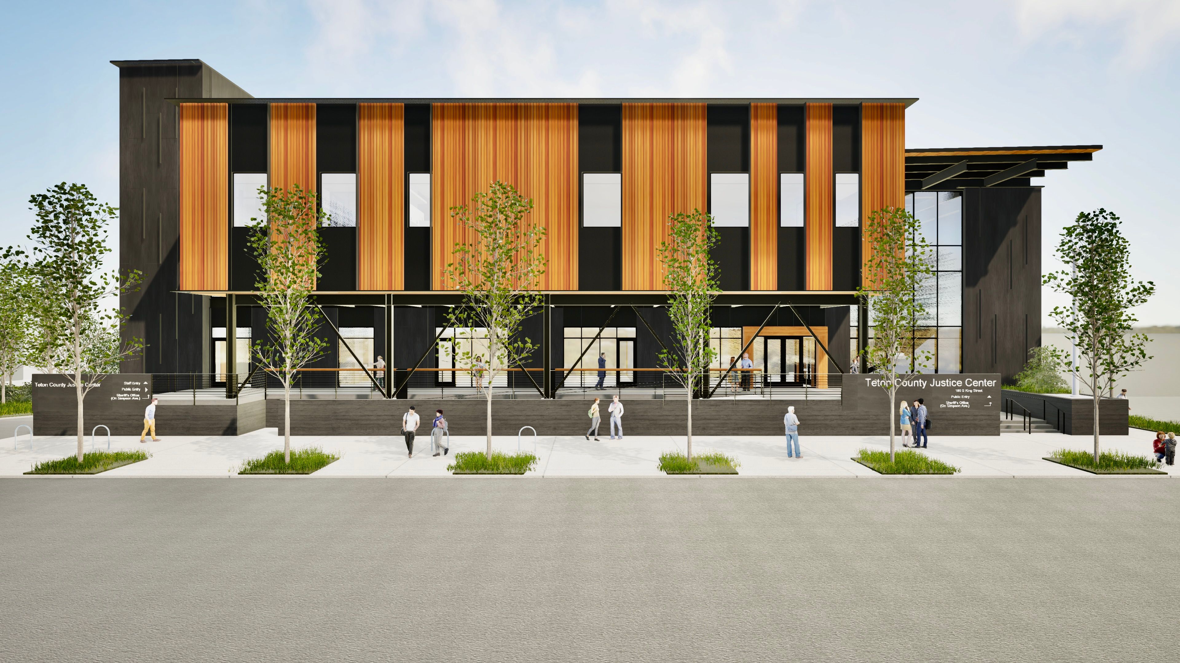 A straight-on architectural elevation of the Justice Center. The building sits on a raised concrete base with a metal-railed porch area. The facade is dominated by a repeating pattern of golden-brown vertical wood panels and dark grey sections. The far right side features a tall glass atrium. Multiple pedestrians and cyclists are shown on the wide sidewalk in front.