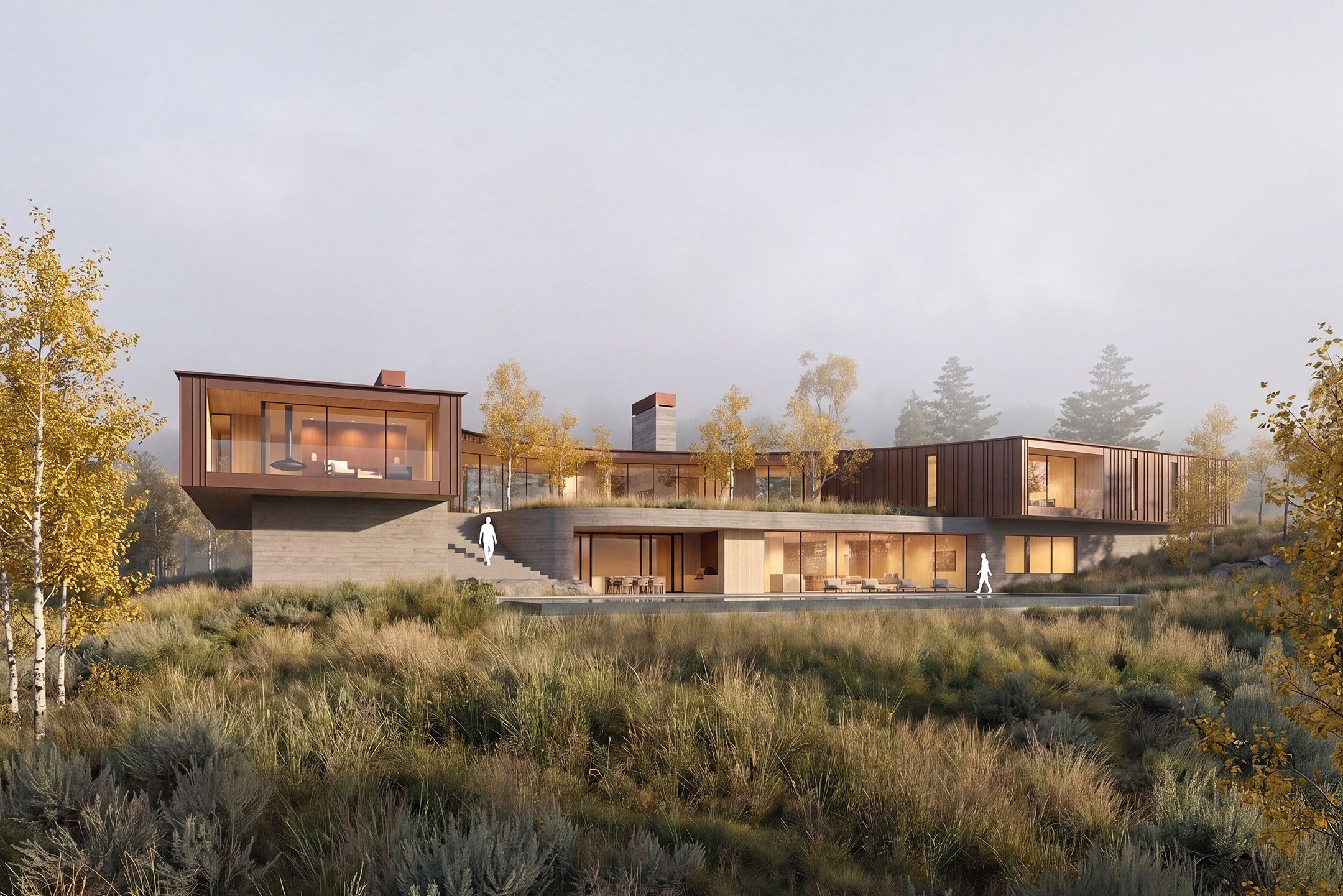 Modern two-story mountain home built into a grassy, brush-covered hill with large floor-to-ceiling windows and dark wood siding.