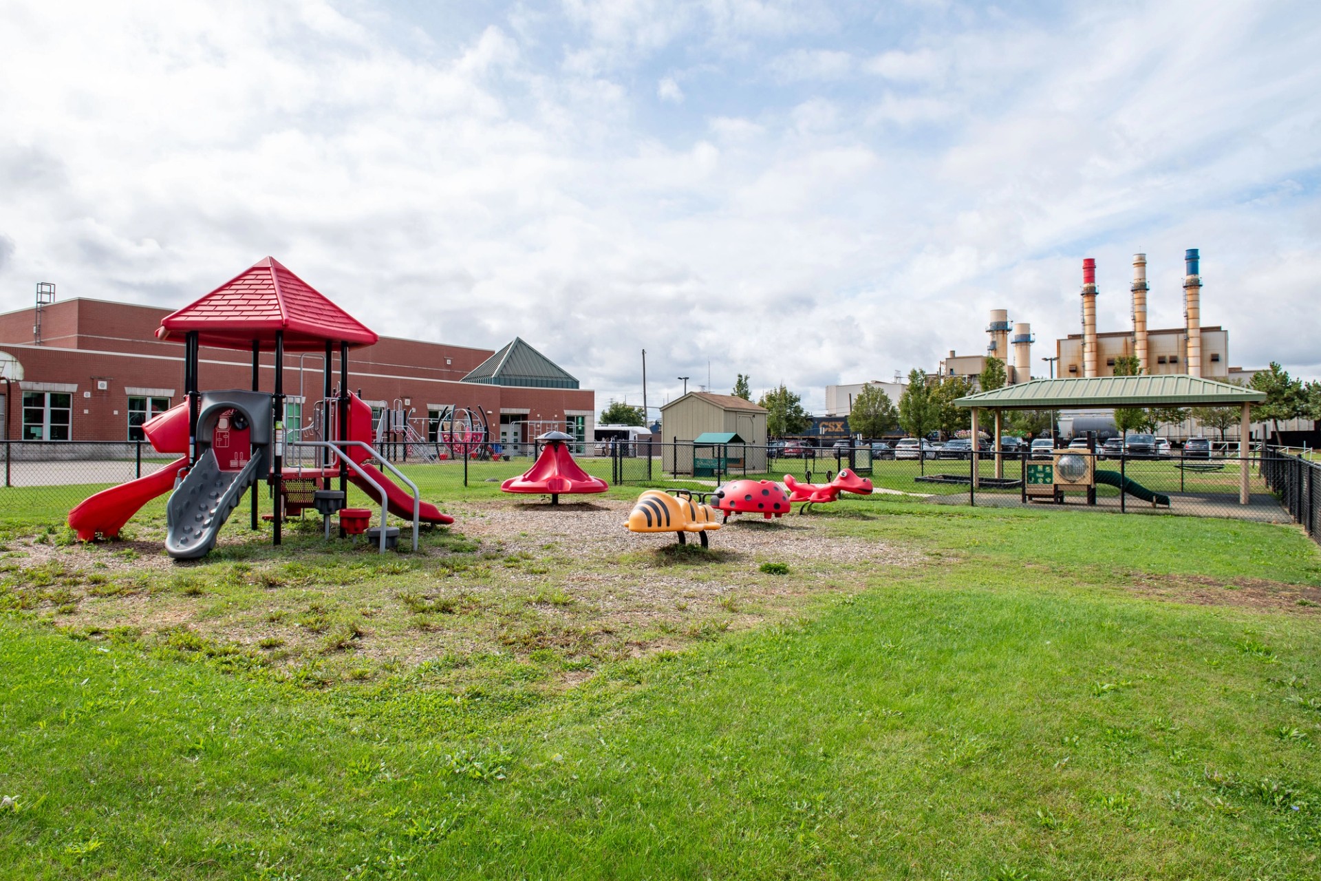 Salinas Intermediate School playground sits in the shadow of the Dearborn Industrial Generator. Further across the street the Cleveland Cliffs Dearborn Works mill looms.