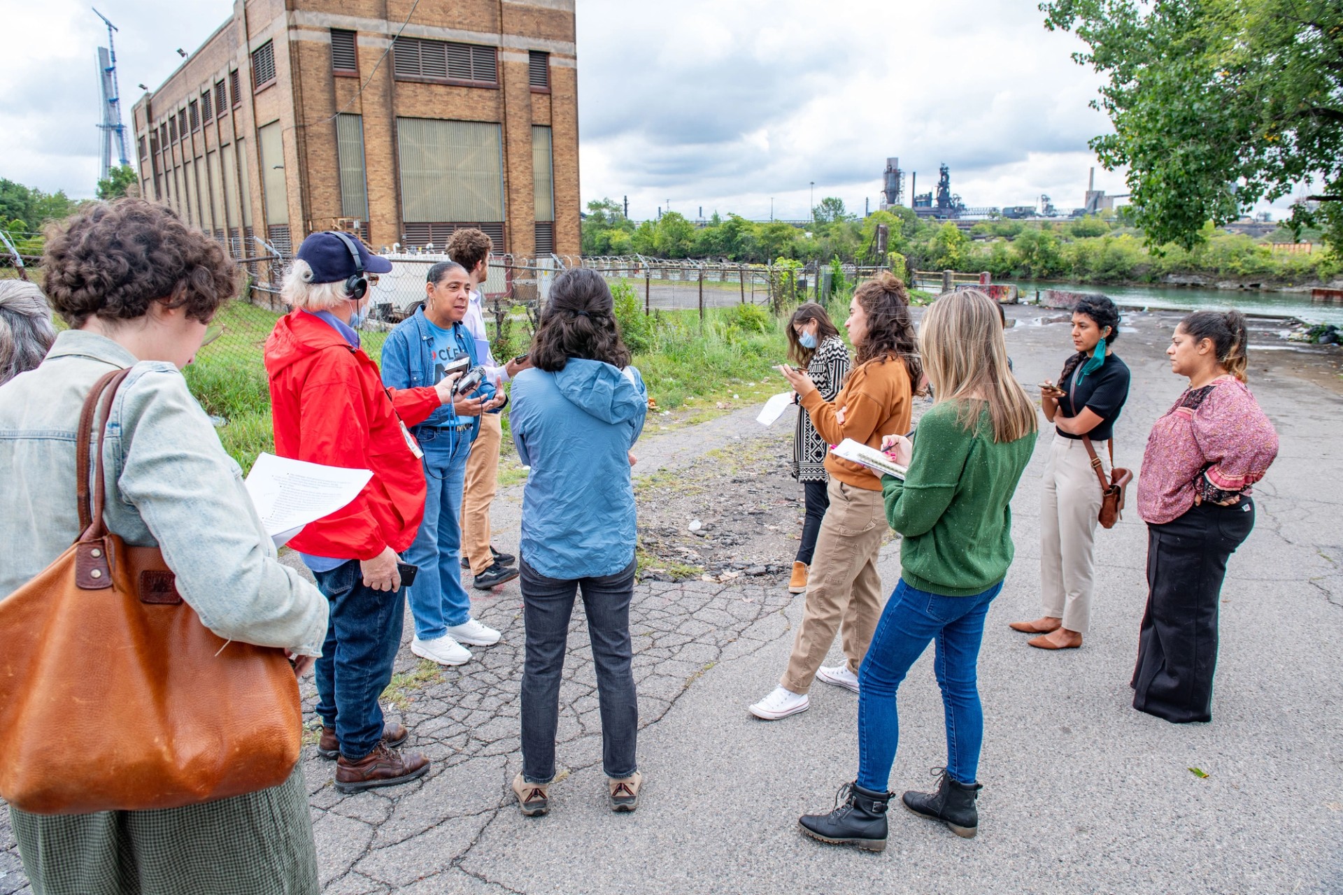 Theresa Landrum speaking in Detroit’s Delray neighborhood with EES Coke on Zug Island in the background.