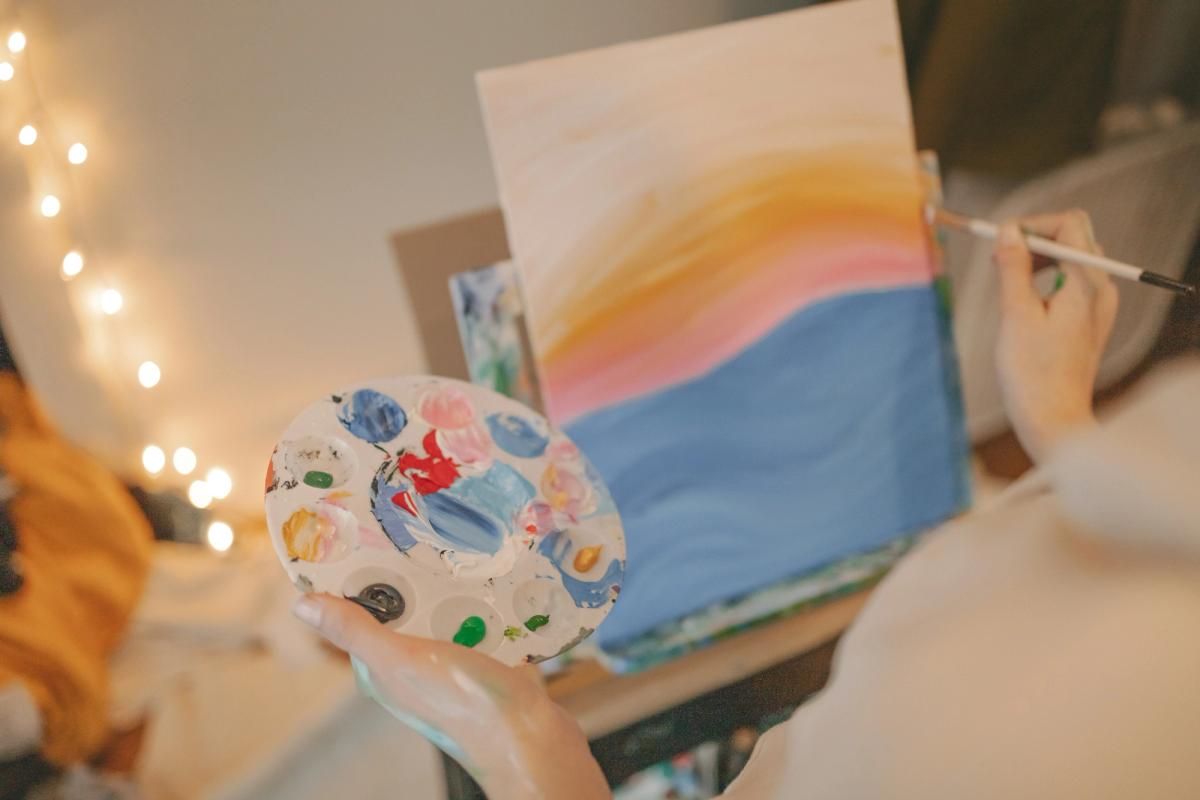 Someone painting on an easle