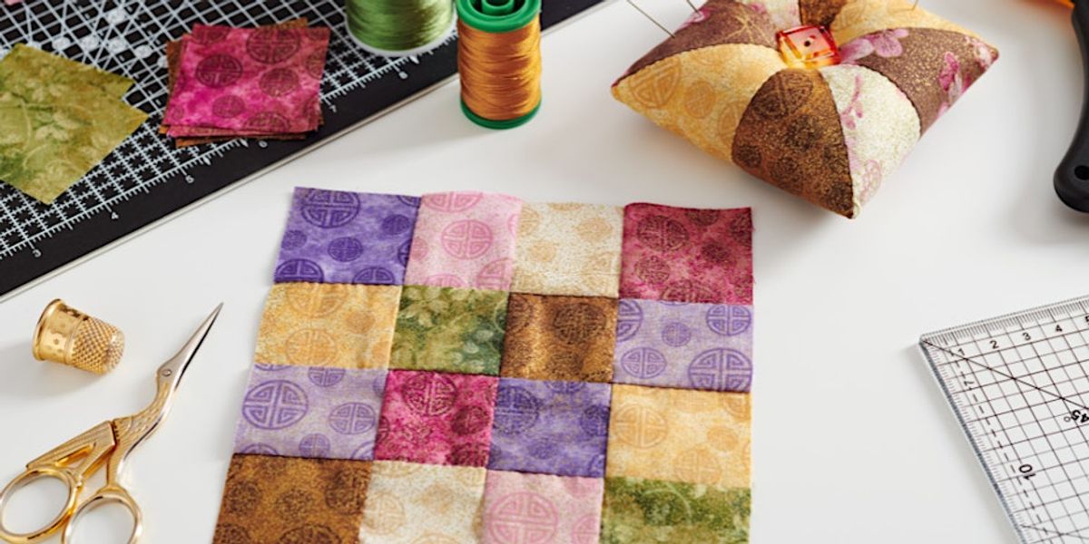 a quilted sewn square of different colors
