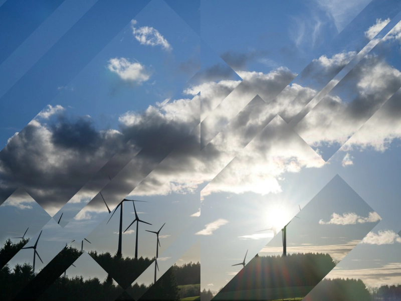 Wind turbines at sunset with geometric displacement effect