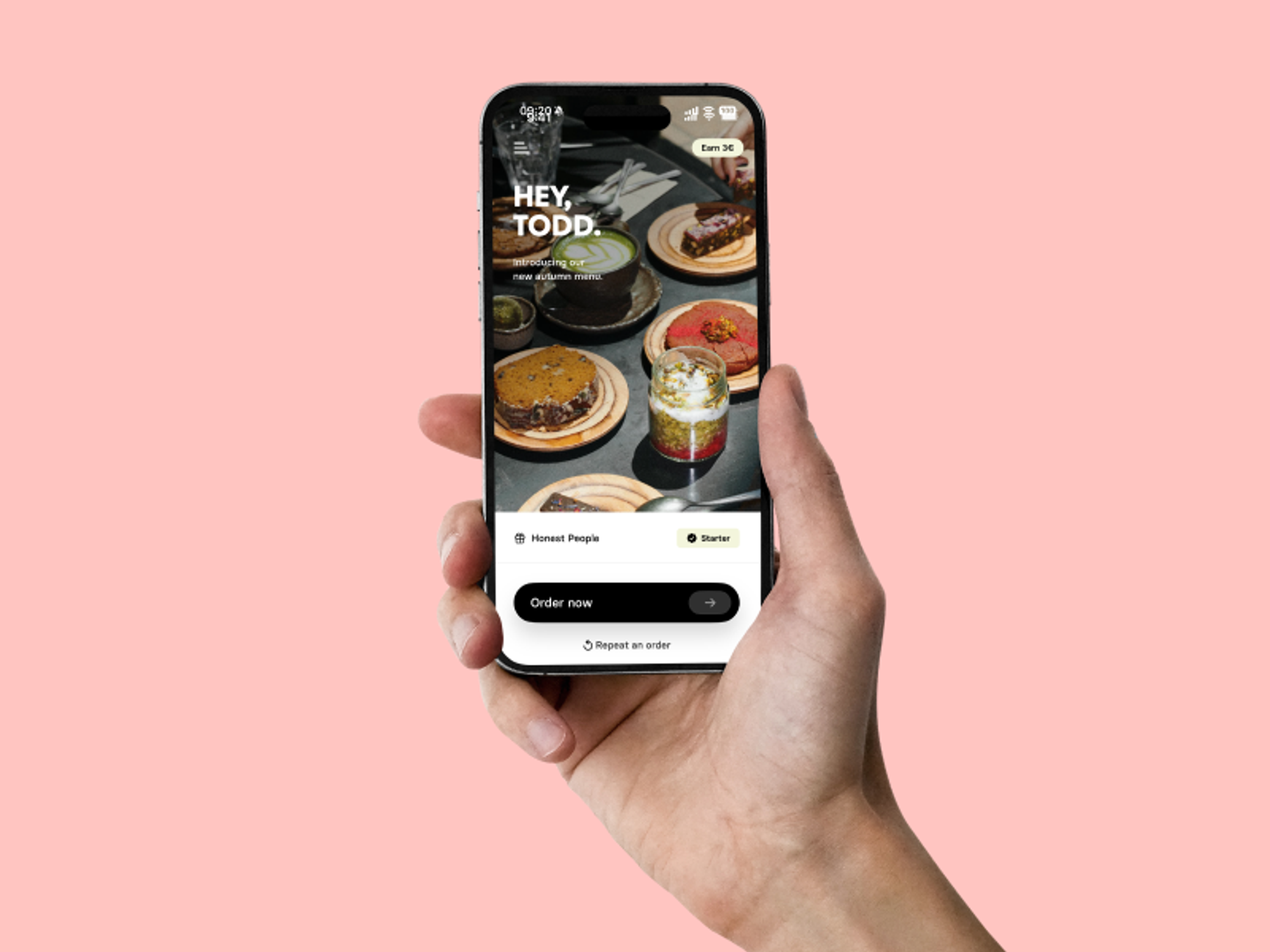 Hand holding a smartphone with the Honest Greens App