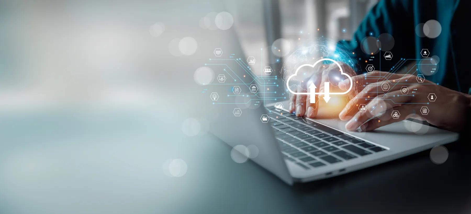 Hands typing on a laptop with a glowing cloud icon and connected service symbols above the keyboard