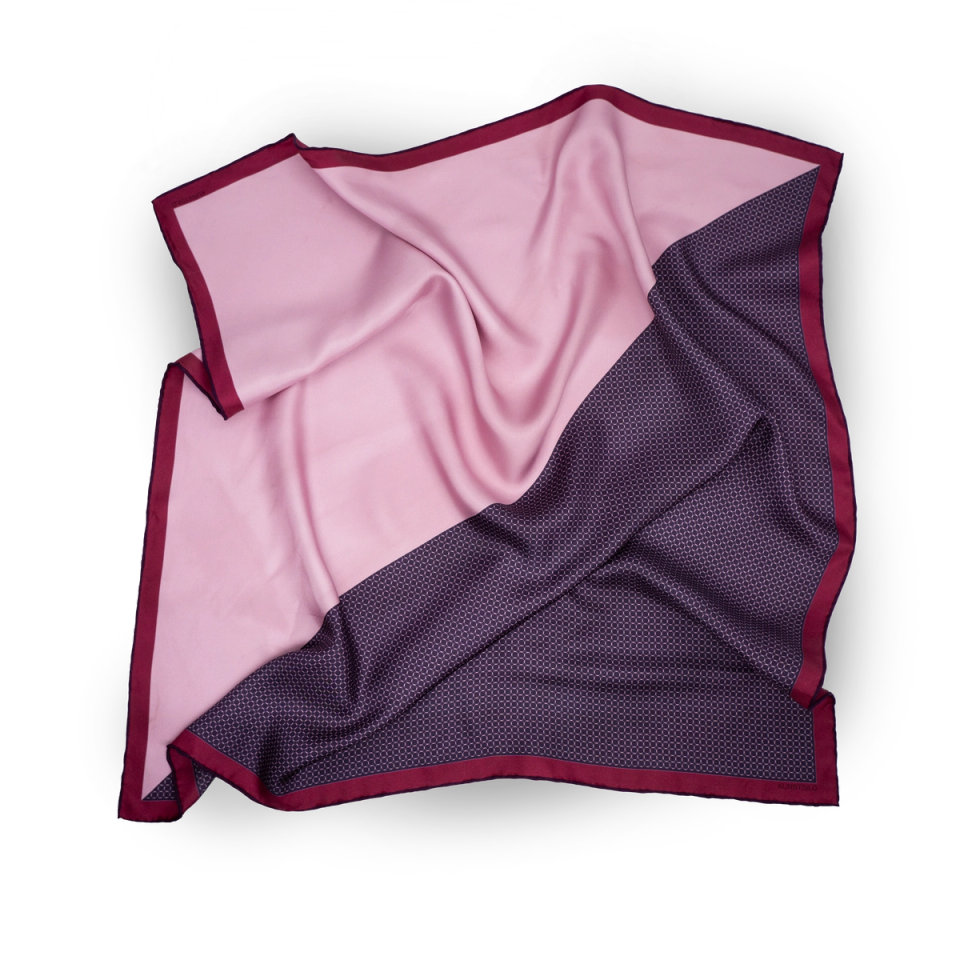 The Signature Bandana in a second colourway — soft rose on one face, deep plum dot-pattern on the other