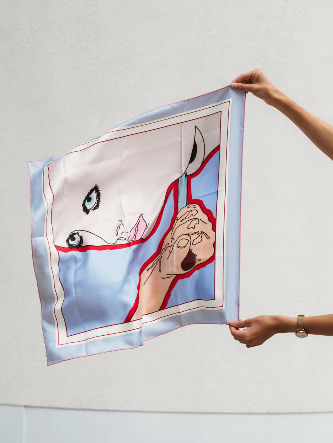 The full American Dream silk scarf held up — the complete pop-art print, blue ground, the face and red border